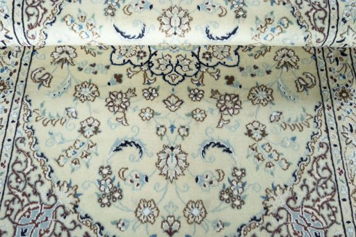 Close-up detail of 2000s Nain rug from Iran / Persia showing Wool weave