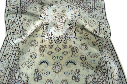 Surface texture of 2000s Nain rug with natural Wool and intricate pattern