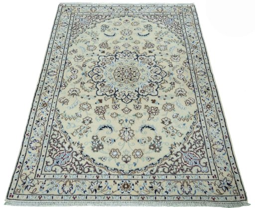 Surface texture of 2000s Nain rug with natural Wool and intricate pattern