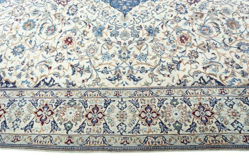 Corner detail of 2000s Nain rug showing border pattern and Wool pile