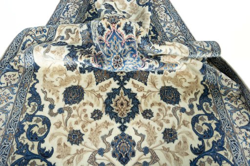 Surface texture of 2000s Nain rug with natural Wool and intricate pattern