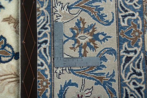 Backside of handmade 2000s Nain rug showing knot structure and weave density