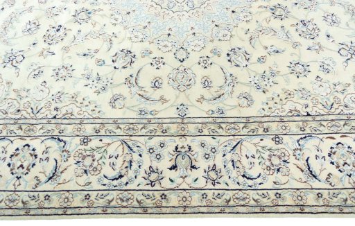Corner detail of 2000s Nain rug showing border pattern and Wool pile