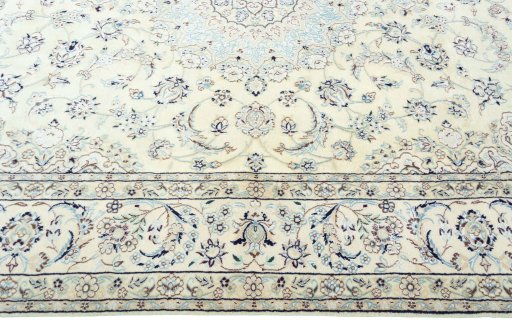 Corner detail of 2000s Nain rug showing border pattern and Wool pile