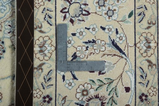 Backside of handmade 2000s Nain rug showing knot structure and weave density