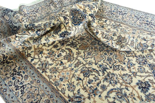 Surface texture of 2000s Nain rug with natural Wool and intricate pattern
