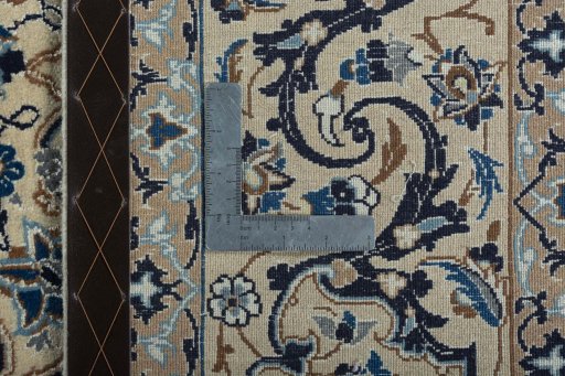 Backside of handmade 2000s Nain rug showing knot structure and weave density