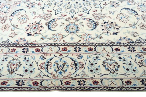 Corner detail of 2000s Nain rug showing border pattern and Wool pile