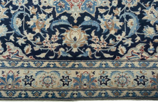 Corner detail of 2000s Nain rug showing border pattern and Wool pile