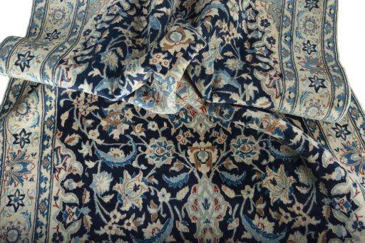 Surface texture of 2000s Nain rug with natural Wool and intricate pattern