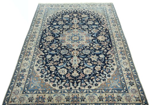 Surface texture of 2000s Nain rug with natural Wool and intricate pattern