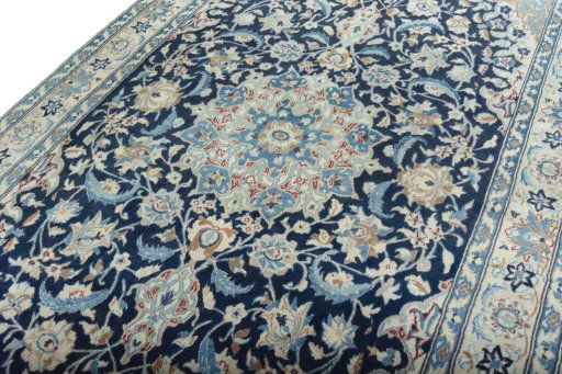 Backside of handmade 2000s Nain rug showing knot structure and weave density