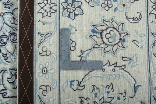 Backside of handmade New Nain rug showing knot structure and weave density