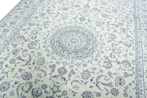 Backside of handmade New Nain rug showing knot structure and weave density