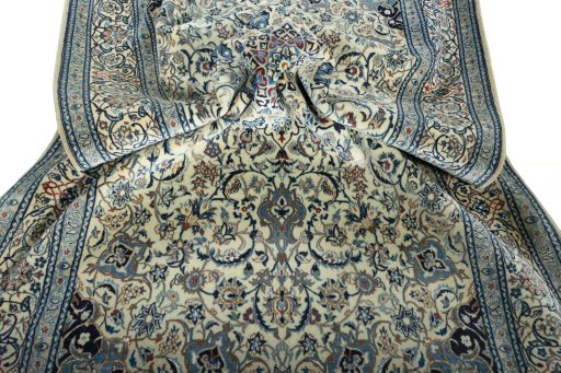 Surface texture of 2000s Nain rug with natural Cork and intricate pattern
