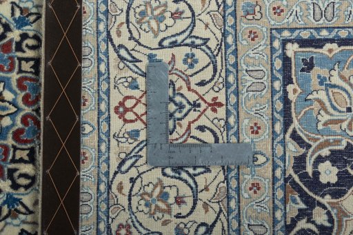 Backside of handmade 2000s Nain rug showing knot structure and weave density