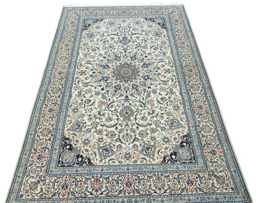 Surface texture of 2000s Nain rug with natural Cork and intricate pattern