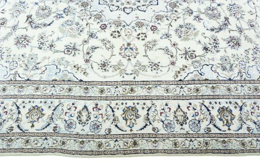 Corner detail of 2000s Nain rug showing border pattern and Wool pile