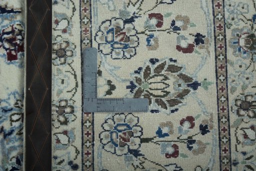 Backside of handmade 2000s Nain rug showing knot structure and weave density