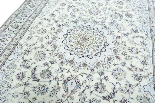 Backside of handmade 2000s Nain rug showing knot structure and weave density