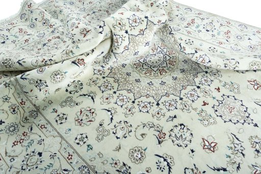 Surface texture of 2000s Nain rug with natural Wool and intricate pattern
