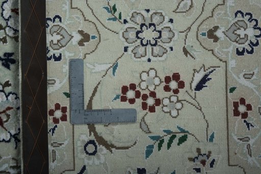 Backside of handmade 2000s Nain rug showing knot structure and weave density