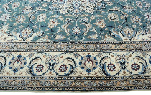 Corner detail of 2000s Nain rug showing border pattern and Wool pile
