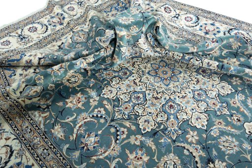 Surface texture of 2000s Nain rug with natural Wool and intricate pattern