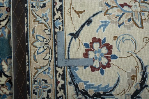 Backside of handmade 2000s Nain rug showing knot structure and weave density