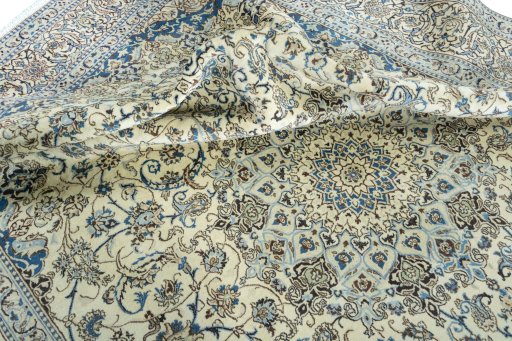 Surface texture of 2000s Nain rug with natural Wool and intricate pattern