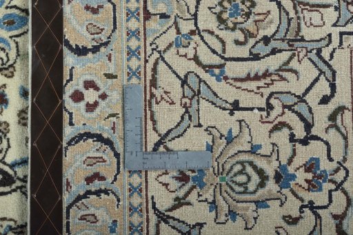 Backside of handmade 2000s Nain rug showing knot structure and weave density