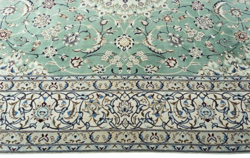 Corner detail of 2000s Nain rug showing border pattern and Wool pile