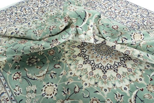 Surface texture of 2000s Nain rug with natural Wool and intricate pattern