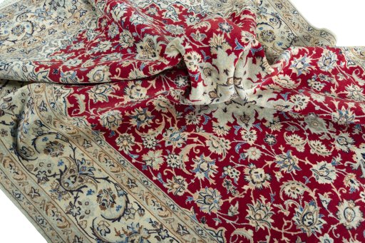 Surface texture of 2000s Nain rug with natural Wool and intricate pattern