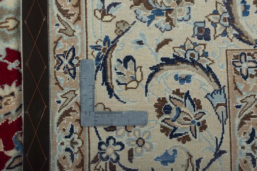 Backside of handmade 2000s Nain rug showing knot structure and weave density