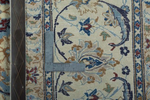 Backside of handmade 2000s Nain rug showing knot structure and weave density