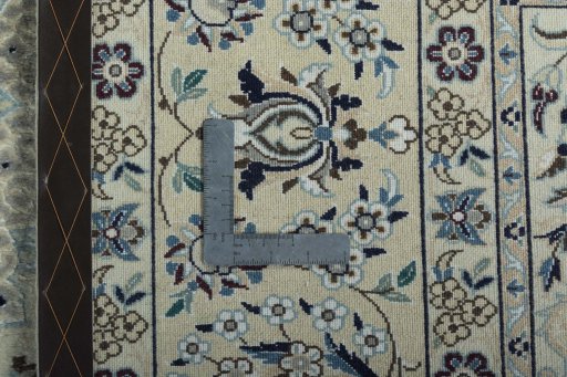 Backside of handmade 2000s Nain rug showing knot structure and weave density