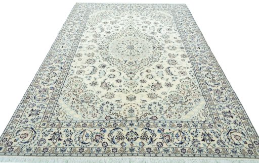Surface texture of 2000s Nain rug with natural Wool and intricate pattern