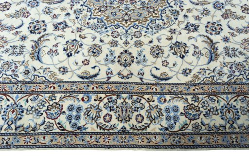 Corner detail of 2000s Nain rug showing border pattern and Wool pile