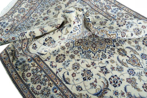 Surface texture of 2000s Nain rug with natural Wool and intricate pattern