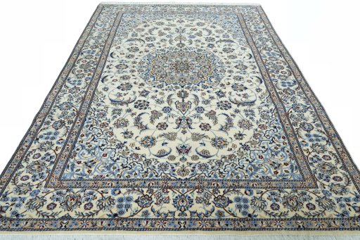Surface texture of 2000s Nain rug with natural Wool and intricate pattern