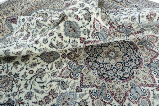 Surface texture of 2000s Nain rug with natural Cork and intricate pattern