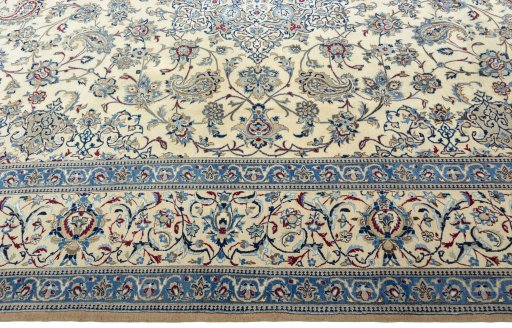 Corner detail of 2000s Nain rug showing border pattern and Wool pile