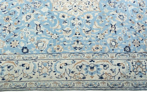 Corner detail of 2000s Nain rug showing border pattern and Wool pile
