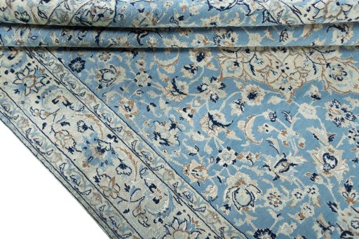 Close-up detail of 2000s Nain rug from Iran / Persia showing Wool weave