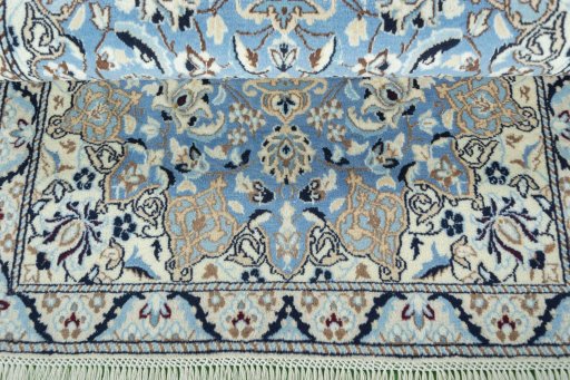 Corner detail of 2000s Nain rug showing border pattern and Wool pile
