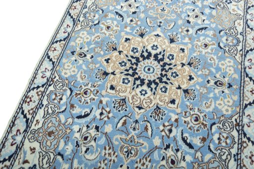 Backside of handmade 2000s Nain rug showing knot structure and weave density