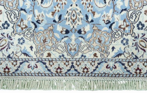 Close-up detail of 2000s Nain rug from Iran / Persia showing Wool weave