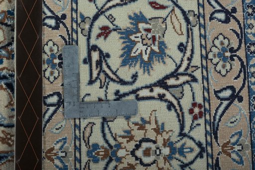 Backside of handmade New Nain rug showing knot structure and weave density