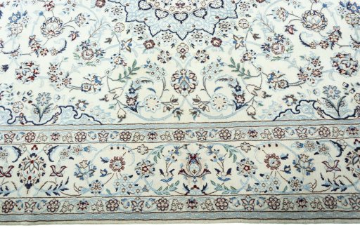 Corner detail of New Nain rug showing border pattern and Wool pile